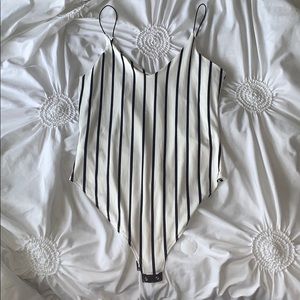 Black and white striped body suit